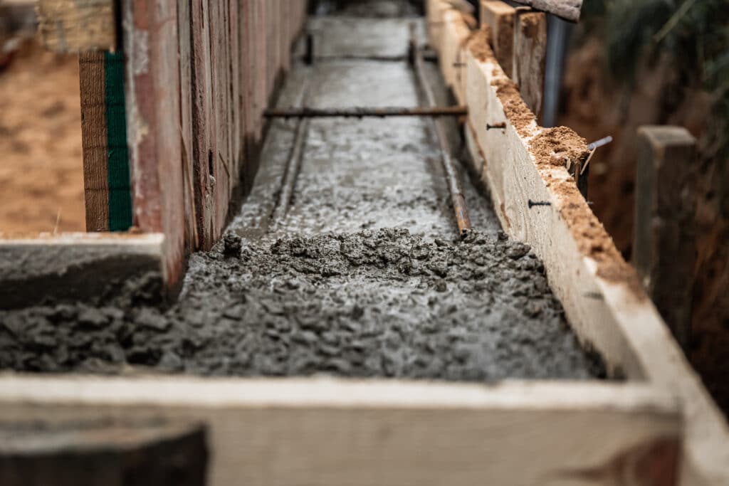 Timber formwork with metal reinforcement to create a concrete foundation