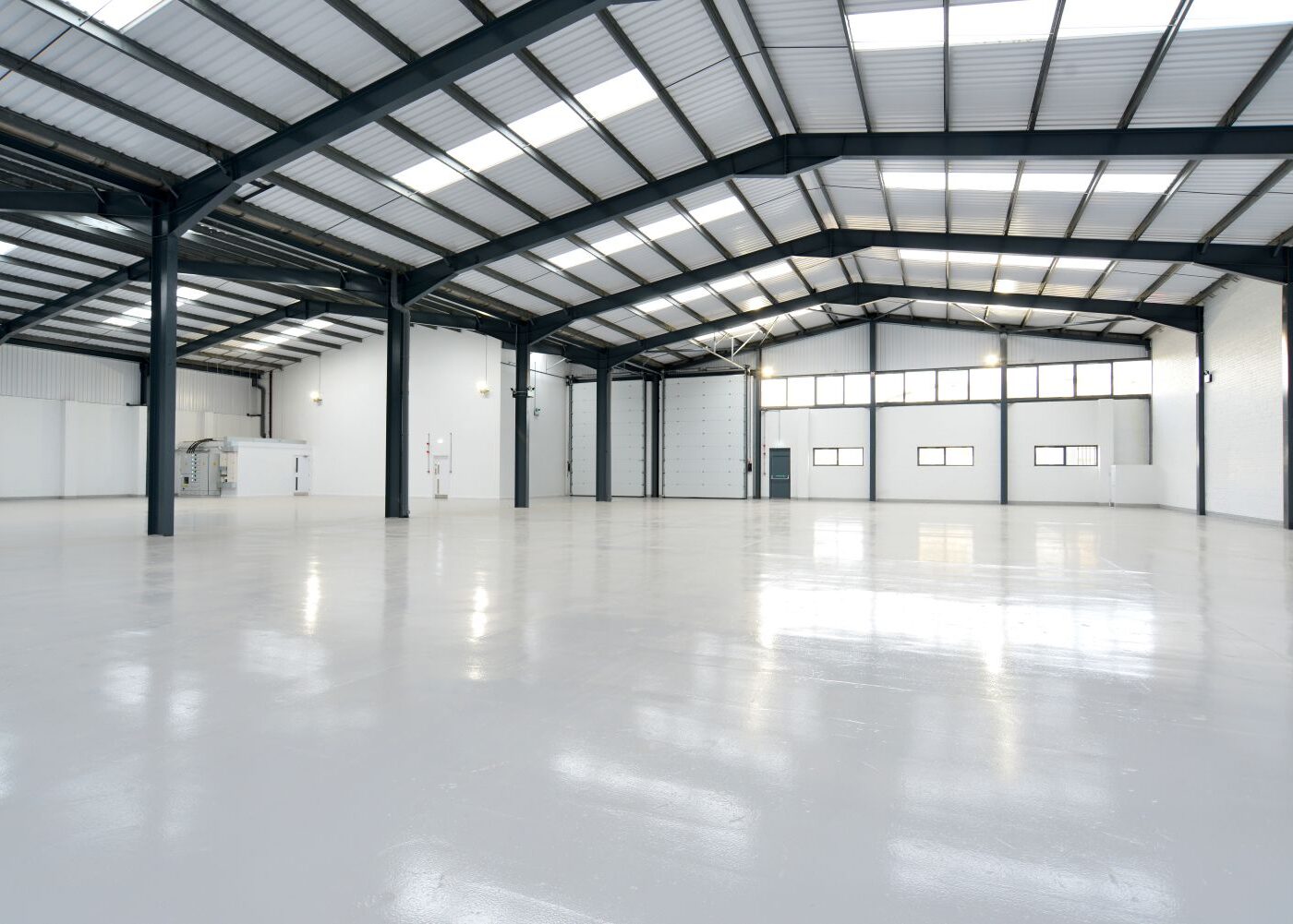 large warehouse with white concrete floors