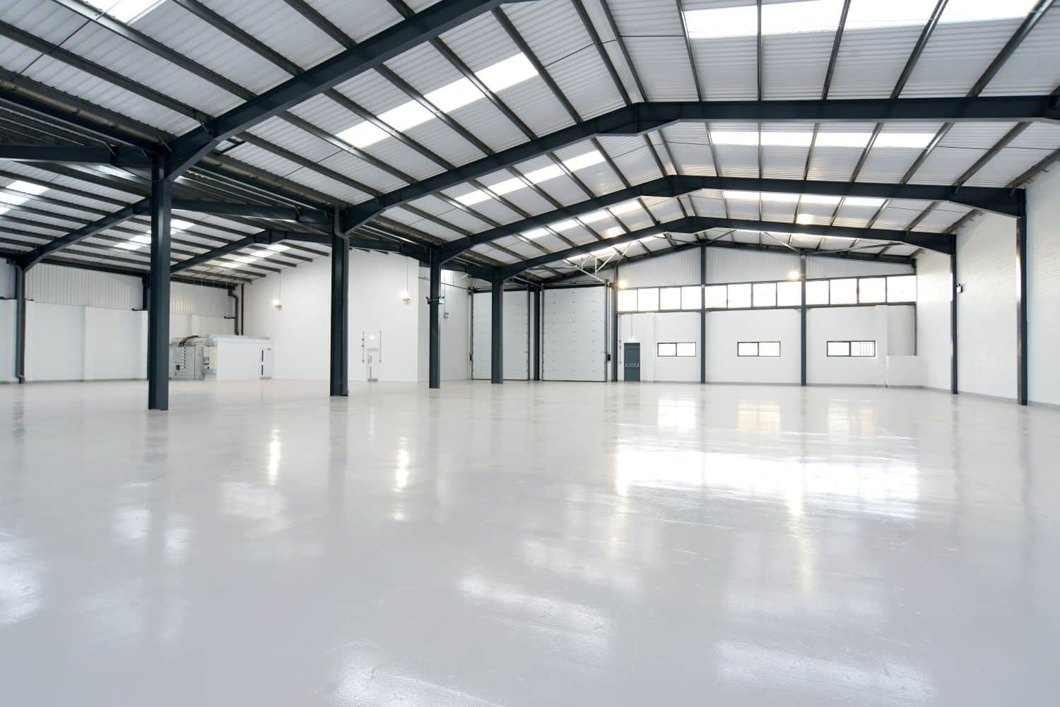 large warehouse with white concrete floors